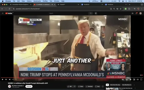 Donald Trump is seen in a McDonald's kitchen, wearing a white shirt, red tie, and a dark apron, suggesting he is participating in a hands-on activity. The setting is bustling, with kitchen equipment visible, indicating a fast-food restaurant environment. The screenshot captures Donald Trump gesturing or speaking, possibly interacting with others nearby, though they are partially obscured.
Text overlays display "Sky News Australia" and "E-TREVOSE, PA," indicating the location. The screen reads "Decision 2024," suggesting a connection to political events. Below, a ticker states, "Now: Trump stops at Pennsylvania McDonald's," highlighting the setting and action. On the right, an MSNBC logo appears along with a schedule for "Today 5 PM ET" featuring "Exclusive" with "Vice President Kamala Harris," indicating related news programming.
The image is part of a YouTube video titled "MSNBC in meltdown after Donald Trump's McDonald's shift," from the channel "Sky News Australia." The caption "Just another" appears over the image, adding a humorous or ironic tone to the scenario. The overall atmosphere combines political, business, and informal elements, capturing an unusual and notable moment involving Donald Trump.