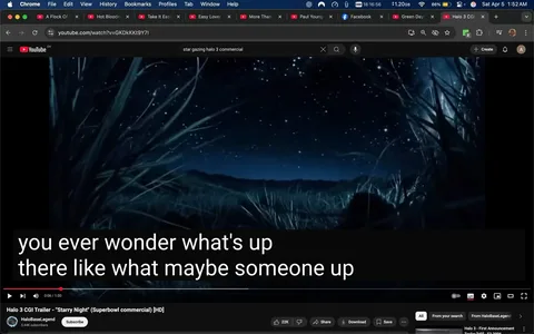 The image displays a scene from a YouTube video titled "Halo 3 CGI Trailer - 'Starry Night' (Superbowl commercial) [HD]." The video is hosted on the YouTube platform, indicated by the familiar red play button and interface elements. 

In the foreground, there is a dark, grassy area with tall blades of grass that appear to be swaying gently. The grass is depicted in shades of blue and green, contributing to a nighttime atmosphere. The background features a vast, starry sky filled with numerous bright stars scattered across a deep blue canvas. The sky transitions from a darker hue at the top to a lighter shade near the horizon, suggesting the presence of distant mountains or hills silhouetted against the sky.

At the bottom of the image, there is a text overlay that reads: "you ever wonder what's up there like what maybe someone up." This text is presented in a bold, white font with a black background, making it easily readable against the darker scene. 

The video player controls are visible at the bottom, including options to like, share, download, and subscribe, along with the view count of 22K. The channel name "HaloBaseLegend" is displayed, along with a subscriber count of 5.44K. 

Overall, the image captures a serene and contemplative moment, emphasizing the beauty of the night sky while promoting the Halo 3 video game.