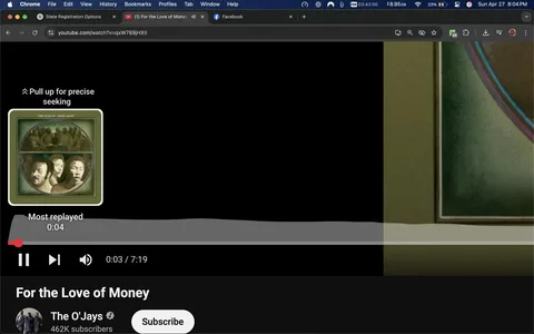 The image displays a screenshot of a YouTube video player interface. The video is titled "For the Love of Money" by The O'Jays, which is indicated in the lower section of the image. The channel name, "The O'Jays," is displayed prominently, along with a subscriber count of 462K. Below the title, there is a "Subscribe" button visible.

In the upper left corner, there is a thumbnail image that appears to be the album cover for the song. The cover features a green background with a circular design that includes the faces of three men. The men have serious expressions, and their faces are depicted in a stylized manner. The background of the thumbnail shows a group of people, possibly in a crowd, but their features are not clearly defined.

The video player controls are visible at the bottom of the image, showing a play button, a timeline slider, and a timestamp indicating the video is currently at 0:03 out of a total length of 7:19. The section labeled "Most replayed" indicates that the video has segments that are frequently revisited by viewers.

The overall setting is digital, as it is a screenshot of a video streaming platform. The background is mostly black, with the video player and album cover being the main focal points. No additional people, clothing, or environmental context is present in the image, as it is solely focused on the video interface.