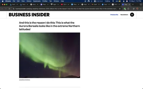 The image displays a vibrant photograph of the Aurora Borealis, also known as the Northern Lights. The scene is set against a dark night sky, where the aurora manifests as a large, flowing band of green light, with hints of other colors blending subtly in the background. The green light appears to ripple and wave, creating a dynamic and ethereal effect. 

In the background, there are faint stars scattered across the sky, adding to the celestial ambiance. The lower portion of the image shows a dark silhouette of a mountain or hill, which provides a stark contrast to the luminous display above. The overall atmosphere of the image conveys a sense of wonder and beauty associated with natural phenomena.

At the top of the image, there is a header that reads "BUSINESS INSIDER" in bold, uppercase letters. Below this, there is a caption that states, "And this is the reason I do this: This is what the Aurora Borealis looks like in the extreme Northern latitudes!" This text is presented in a standard font, providing context for the image.

The photographer's name, "Jonathan Hirshon," is also visible at the bottom of the image, indicating authorship. The layout suggests that this image is part of an article or feature on the Business Insider website, focusing on the beauty of the Aurora Borealis. 

Overall, the image captures a stunning natural light display, framed by a serene night landscape, with accompanying textual elements that provide context and attribution.