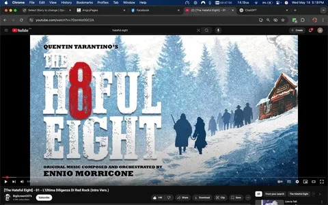 The image features a promotional graphic for the film "The Hateful Eight," directed by Quentin Tarantino. The title is prominently displayed in large, bold text, with "THE" in white, "H8FUL" in red, and "EIGHT" in white again. The number "8" is stylized with a red color that stands out against the white background. Below the title, there is a line of text that reads "Original Music Composed and Orchestrated by Ennio Morricone," indicating the composer of the film's score.

The background of the image depicts a snowy landscape with tall evergreen trees, creating a cold, wintry atmosphere. In the foreground, there are silhouettes of several figures walking along a snow-covered path. The figures appear to be dressed in long coats and hats, typical of a Western setting, suggesting they are possibly cowboys or travelers. One figure is holding a rifle, while another appears to be holding hands with another person, indicating a sense of companionship.

To the right of the figures, there is a small wooden cabin with a slanted roof, partially covered in snow. The cabin has a sign that reads "MINNIE'S HABERDASHERY," which is likely the name of the establishment featured in the film. The cabin's wood texture is visible, and it has a rustic appearance, contributing to the Western theme of the image.

The overall color palette consists of cool blues and whites, with the red of the title providing a stark contrast. The image has a slightly textured look, enhancing the artistic quality of the graphic. The bottom of the image features a YouTube video player interface, including a play button, a timeline, and options to subscribe, share, download, and clip the video. The channel name "BigScreenOSTs" is also visible, along with a subscriber count of 4.54K. The video title is "[The Hateful Eight] - 01 - L'Ultima Diligenza Di Red Rock (Intro Vers.)."

No identifiable people are present in the image, and all figures are depicted as silhouettes without discernible facial features or expressions. The setting is clearly related to the film "The Hateful Eight," which is known for its Western themes and ensemble cast.