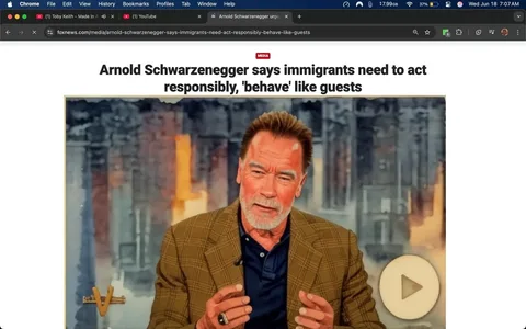 The image is a screenshot of a webpage from Fox News, featuring an article titled "Arnold Schwarzenegger says immigrants need to act responsibly, 'behave' like guests." The headline is prominently displayed at the top in bold, black text. Below the headline, there is a subheading that reads, "Former California governor criticized both parties for failing to pass immigration reform," also in black text.

The article is authored by Hanna Panreck and includes a publication date of June 17, 2025, at 2:22 PM EDT. There are social media icons visible at the top of the article, including Facebook, Twitter, and others, indicating options for sharing the article.

In the central part of the image, there is a video still featuring a man with a light brown, checkered blazer over a dark shirt. He has short, dark hair with some gray, and a beard. His facial expression appears animated, as he gestures with his hands while speaking. The background of the video still shows a blurred, colorful backdrop, possibly indicating a television studio setting, with soft lighting and abstract shapes.

To the left of the video still, there is a caption that reads, "Arnold Schwarzenegger touts 'responsibility' of immigrants on 'The View'," indicating that this segment is related to a television appearance. The text also mentions that he discussed the responsibility of immigrants to follow laws and contribute positively to society.

There is a play button overlay on the video still, suggesting that it is a video segment that can be played. The overall layout of the webpage is clean, with a white background and a structured format typical of news articles. The article appears to be part of a larger media section labeled "MEDIA."

No additional objects, logos, or trademarks are visible in the image aside from the website's branding. The focus remains on the article's content and the video still of the man speaking.