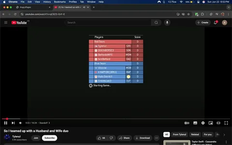 The image displays a screenshot from a YouTube video titled "So I teamed up with a Husband and Wife duo," uploaded by a user named Tylenul, who has 5.9K subscribers. The video is currently at 22 seconds into a 16-minute and 24-second runtime. 

In the center of the image, there is a scoreboard for a game, divided into two teams: Red Team and Blue Team. The Red Team consists of four players: 
1. Tylenul (S39)
2. DEATHBOY923 (SON)
3. BelfordsWIFE (MOM)
4. IamBelford (DAD)

Each player has a score of 0.

The Blue Team also has four players:
1. Uicorne (MOB)
2. X RAPTORCORN X (RAP)
3. Halo Overkill (unknown designation)
4. SnkAtkJak3 (117)

Similar to the Red Team, all players on the Blue Team have a score of 0.

The scoreboard is presented in a rectangular format with a red background for the Red Team and a blue background for the Blue Team. The text is white, clearly legible against the colored backgrounds. Below the scoreboard, there is a loading icon indicating the game is about to start, with the text "Starting Game..." displayed.

The video player interface is visible at the bottom of the image, showing options to join, subscribe, share, and download. There are also icons indicating the number of likes (66) and a comment section.

The background of the image is predominantly black, which is typical for gaming interfaces, creating a contrast with the scoreboard. The top of the image shows the YouTube interface, including the search bar and channel name, along with a notification icon indicating one new notification.

Overall, the image captures a gaming session setup, focusing on the scoreboard and video player interface, with no visible people or additional environmental context.