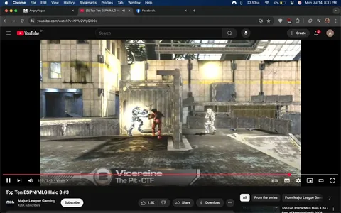 - subjects: two armored characters, one in red, one in blue, a gray container, a gray background  
- actions: red character engaging with blue character, blue character appearing to attack, white character in background observing  
- context: YouTube video player interface, "Top Ten ESPN/MLG Halo 3 #3" title, "The Pit - CTF" text, Major League Gaming logo  
- risks: simulated violence, competitive gaming context  
- mood: intense, competitive, dynamic, focused