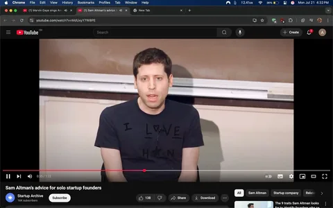 The image shows a man seated in front of a classroom setting, speaking directly to an audience. He has short, dark hair and is wearing a black t-shirt with the text "I LOVE H" printed on it, where the "O" is represented by a heart symbol. The background features a brown chalkboard and a whiteboard, suggesting an educational environment.

His facial expression is serious and focused, indicating he is engaged in a discussion or giving advice. His body language is open, with his hands resting on his knees, suggesting a relaxed yet attentive demeanor. The video title below indicates that he is sharing advice for solo startup founders, hinting at a motivational or instructive tone.

The bottom left corner displays the YouTube interface, including the video progress bar and viewer engagement metrics, such as "138" likes. The overall mood appears to be informative and supportive, aimed at aspiring entrepreneurs.