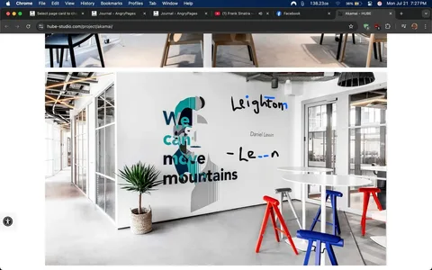 The image showcases a modern office space that exudes a contemporary and creative atmosphere. The focal point is a striking wall mural featuring the text "We can move mountains" in bold, stylized typography. The words are accompanied by the name "Daniel Lewin" and the name "Leighton," suggesting a tribute or inspirational message related to these individuals. The mural also incorporates abstract shapes and colors, including teal and black, which add an artistic flair to the otherwise minimalist environment.

In the foreground, a potted plant with long, slender leaves sits in a woven basket, bringing a touch of nature into the space. This element contrasts nicely with the sleek, industrial design of the office, which features concrete flooring and glass partitions that allow natural light to flood the area. The glass walls create a sense of openness and connectivity, making the office feel inviting and collaborative.

Surrounding the plant are several modern stools in vibrant colors—red, blue, and white—arranged around a circular table. The stools have a unique design, resembling a mix of traditional and contemporary styles, which adds to the eclectic vibe of the space. The red stool stands out prominently, drawing the eye and adding a pop of color to the otherwise neutral palette.

The overall aesthetic of the office is clean and uncluttered, with a focus on functionality and design. The combination of artistic elements, such as the mural and the colorful stools, with the minimalist architecture creates a dynamic environment that likely fosters creativity and innovation. The use of natural light and open spaces suggests a workplace culture that values collaboration and communication.

This image captures a moment in a professional setting that feels both inspiring and approachable. The mural's message, combined with the vibrant decor, conveys a sense of motivation and possibility, inviting employees and visitors alike to embrace challenges and strive for greatness. The thoughtful design choices reflect a modern approach to office spaces, where aesthetics and functionality go hand in hand, promoting a positive and engaging work environment.